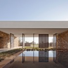 Stone Wall Metallic Natural Stone Wall Ornamental Pool Metallic Swing Door Wide Grassy Courtyard Madison House With Concrete Floor Dream Homes Spectacular And Spacious Contemporary House With Sliding Glass Walls